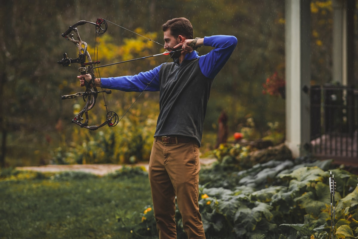 Bowhunter drawing a compound bow